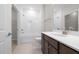 Bathroom featuring a shower and tub combination with tile surround at 1833 Hydrangea Way, Fuquay Varina, NC 27526