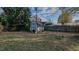 Backyard featuring a storage shed, wooden fence, and mature landscaping at 2434 Orice St, Burlington, NC 27215