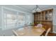 Elegant dining room with natural light, featuring a wooden table and built-in cabinet at 2434 Orice St, Burlington, NC 27215