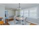 Charming dining room featuring wood floors, a round table, and large windows for ample natural light at 2434 Orice St, Burlington, NC 27215