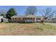 Charming single-story home with brick and vinyl siding, a cozy front porch, and a spacious front yard at 2434 Orice St, Burlington, NC 27215