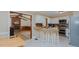 Open kitchen with stainless appliances, breakfast bar and adjacent brick fireplace in the living area at 2434 Orice St, Burlington, NC 27215