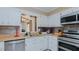Modern kitchen featuring stainless steel appliances, including a double oven and dishwasher, with bright white cabinets at 2434 Orice St, Burlington, NC 27215