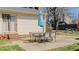 Outdoor patio with table and chairs with blue umbrella perfect for entertaining at 2434 Orice St, Burlington, NC 27215