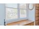 Bright window with wooden shelf and blinds, complemented by a decorative mirror at 2434 Orice St, Burlington, NC 27215