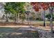Landscaped backyard with pergola, white swing, and brick pavers at 4027 Green Forest Ct, Rocky Mount, NC 27804