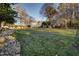 Large grassy backyard with shed and trees in background at 4027 Green Forest Ct, Rocky Mount, NC 27804