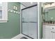 Bathroom with a large walk-in shower and green walls at 4027 Green Forest Ct, Rocky Mount, NC 27804