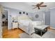 Bright bedroom featuring a king-size bed and hardwood floors at 4027 Green Forest Ct, Rocky Mount, NC 27804