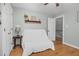 Bedroom with hardwood floors, a daybed, and access to upper hallway at 4027 Green Forest Ct, Rocky Mount, NC 27804