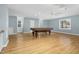 Game room featuring hardwood floors, pool table, and multiple windows at 4027 Green Forest Ct, Rocky Mount, NC 27804