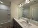 Bright bathroom featuring double vanity with quartz countertop, and tub/shower at 424 La Maison Ave # 9, Wendell, NC 27591