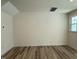 Empty bedroom featuring a large closet and hardwood-style floors at 424 La Maison Ave # 9, Wendell, NC 27591