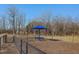 Dog park with shade umbrella and benches at 424 La Maison Ave # 9, Wendell, NC 27591