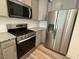 Close-up of the modern stainless steel appliances including the gas range and refrigerator at 424 La Maison Ave # 9, Wendell, NC 27591