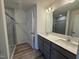 Main bathroom features double sink vanity, large mirror, and shower at 424 La Maison Ave # 9, Wendell, NC 27591