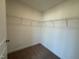 Unfinished walk-in closet featuring carpeted floor and wire shelving at 424 La Maison Ave # 9, Wendell, NC 27591