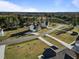 An aerial view showcasing neighborhood homes with spacious yards and a view of surrounding trees at 46 Two Belles Ct, Angier, NC 27501