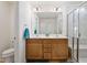 Bathroom featuring double sink vanity, framed mirror, and glass enclosed shower with a bench at 46 Two Belles Ct, Angier, NC 27501