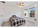 Bedroom featuring neutral carpeting, ceiling fan, and window views at 46 Two Belles Ct, Angier, NC 27501