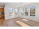 Bright breakfast nook featuring a table, wood floors, and large windows that bring in plenty of natural light at 46 Two Belles Ct, Angier, NC 27501