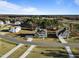 Picturesque two-story home with a welcoming front porch, complemented by landscaped yard in a peaceful community at 46 Two Belles Ct, Angier, NC 27501
