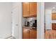 A kitchen featuring a beverage station with upper and lower cabinets at 46 Two Belles Ct, Angier, NC 27501