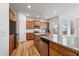 Spacious kitchen with stainless steel appliances, wood cabinets, island with granite countertops, and lots of light at 46 Two Belles Ct, Angier, NC 27501