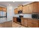 Kitchen with stainless steel appliances, wood cabinets, granite countertops, and white tile backsplash at 46 Two Belles Ct, Angier, NC 27501