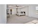 Relaxing main bedroom featuring a tray ceiling, neutral color palette, and adjoining ensuite at 46 Two Belles Ct, Angier, NC 27501