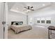 Spacious primary bedroom featuring plush carpet, recessed lighting, and tray ceilings at 46 Two Belles Ct, Angier, NC 27501