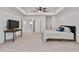 Spacious main bedroom featuring tray ceilings, ceiling fan, and adjoining room entrance at 46 Two Belles Ct, Angier, NC 27501