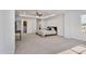 Spacious main bedroom with a tray ceiling, ceiling fan, and attached ensuite bathroom and laundry room at 46 Two Belles Ct, Angier, NC 27501