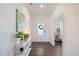 Inviting entryway with a console table, decor, and a view of a sunlit room at 504 Morning Glade St, Wake Forest, NC 27587