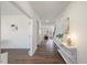 Spacious hallway with wood floors, leading to various rooms in the home at 504 Morning Glade St, Wake Forest, NC 27587