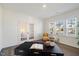 Bright office space with natural light, French doors, and contemporary furnishings at 504 Morning Glade St, Wake Forest, NC 27587