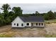 Spacious single-story home with a covered front porch and professional landscaping at 6270 River Rd, Fuquay Varina, NC 27526