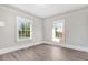 Well-lit bedroom with hardwood floors and large windows at 923 Belvedere St, Rocky Mount, NC 27803