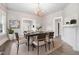 Elegant dining room with chandelier, hardwood floors, and modern decor at 923 Belvedere St, Rocky Mount, NC 27803