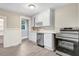 Modern kitchen with white cabinets, stainless steel appliances, and tile backsplash at 923 Belvedere St, Rocky Mount, NC 27803