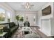 Bright living room with large windows, fireplace, stylish furniture, ceiling fan, and a neutral color palette throughout at 923 Belvedere St, Rocky Mount, NC 27803