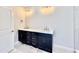 A spacious bathroom featuring a double vanity with modern fixtures at 2625 Silver Gate Ct, Wake Forest, NC 27587