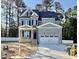 Charming two-story home with a two car garage, black shutters, and manicured lawn at 2625 Silver Gate Ct, Wake Forest, NC 27587