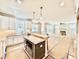 Open-concept kitchen and living area with island, stainless appliances, and abundant natural light at 2625 Silver Gate Ct, Wake Forest, NC 27587