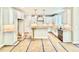 Well-lit kitchen with white cabinetry, an island and stainless steel appliances at 2625 Silver Gate Ct, Wake Forest, NC 27587