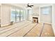 Bright living room featuring a ceiling fan, modern fireplace, and sliding glass doors leading to the outdoor patio at 2625 Silver Gate Ct, Wake Forest, NC 27587