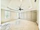 This is a bright bedroom with tray ceilings, a ceiling fan and accent wall at 2625 Silver Gate Ct, Wake Forest, NC 27587