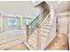 A staircase featuring wooden steps and black wrought iron railings welcomes you into this home at 2625 Silver Gate Ct, Wake Forest, NC 27587