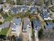 Aerial view of home and neighborhood showing tree-lined streets and neighborhood homes at 3410 Bradley Pl, Raleigh, NC 27607