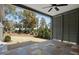 Back patio overlooking a landscaped yard with mature trees and a glimpse of neighborhood homes at 3410 Bradley Pl, Raleigh, NC 27607